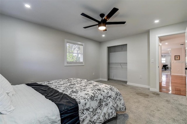 bedroom featuring ceiling fan, a closet, and carpet