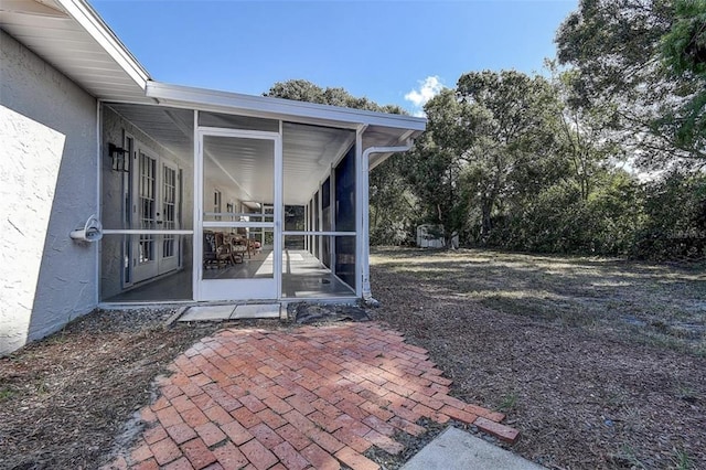 view of yard with a sunroom