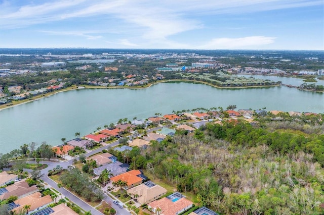 aerial view with a water view and a residential view