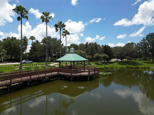 view of dock with a water view and a gazebo