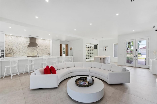 living room featuring recessed lighting and french doors