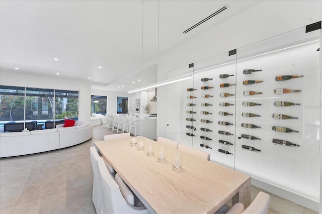 dining room featuring light tile patterned flooring, visible vents, and recessed lighting