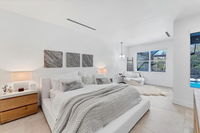 bedroom with visible vents and baseboards