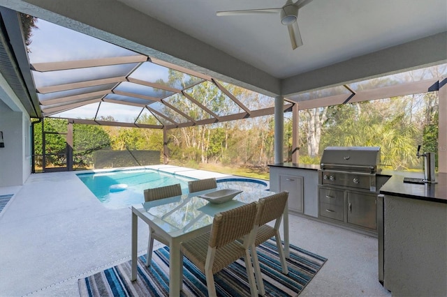 pool featuring glass enclosure, a sink, and area for grilling