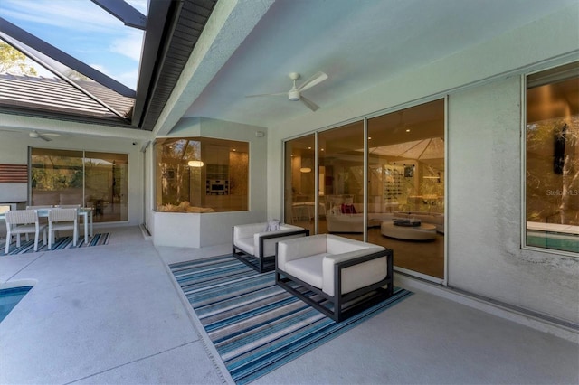 view of patio / terrace with glass enclosure and a ceiling fan