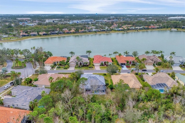 birds eye view of property with a residential view and a water view