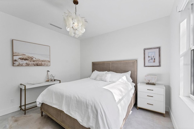 bedroom with baseboards and visible vents