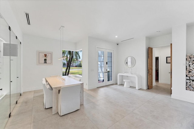 dining space featuring french doors, visible vents, and baseboards