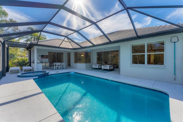 view of pool with outdoor lounge area, a patio area, and a pool with connected hot tub