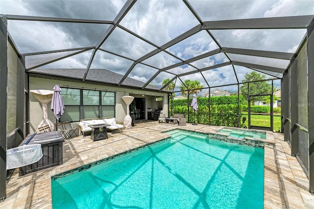 view of swimming pool with an in ground hot tub, a patio area, outdoor lounge area, and glass enclosure