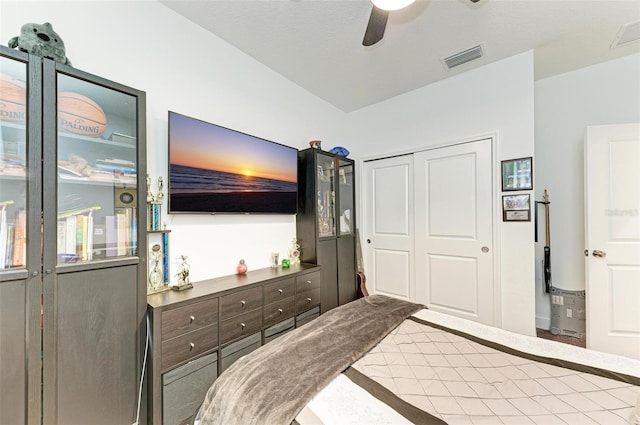 bedroom with ceiling fan and a closet