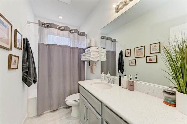 full bathroom featuring vanity, toilet, and shower / bath combo with shower curtain