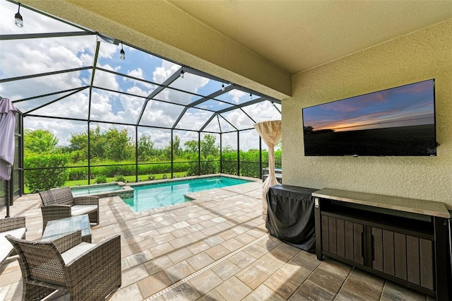 view of swimming pool featuring a patio area and glass enclosure