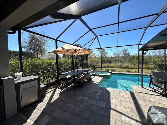 view of swimming pool with an in ground hot tub, a lanai, an outdoor bar, and a patio