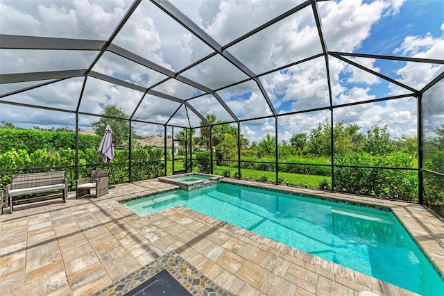 view of swimming pool featuring an in ground hot tub, glass enclosure, and a patio area