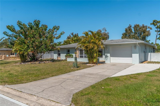 ranch-style home with a garage and a front yard