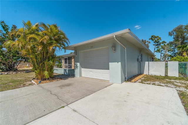 view of side of home featuring a garage