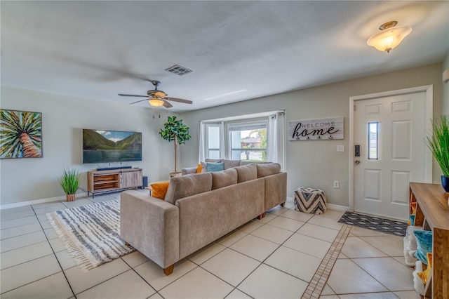 tiled living room featuring ceiling fan