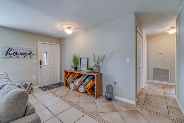 entrance foyer featuring light tile patterned floors