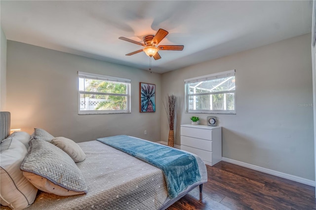 bedroom with dark wood-type flooring and ceiling fan