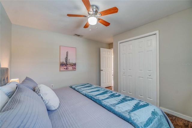 bedroom with wood-type flooring, a closet, and ceiling fan