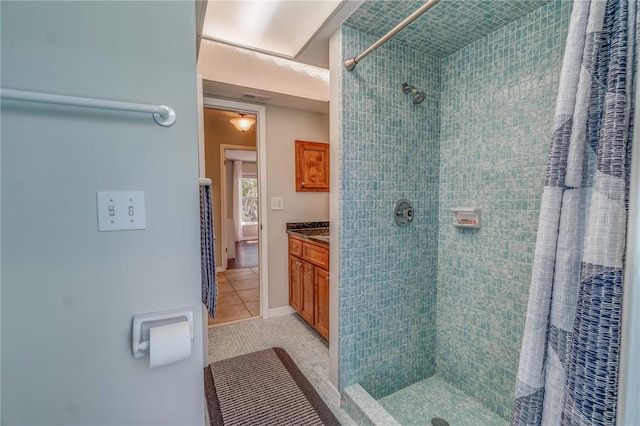 bathroom featuring tile patterned floors, a shower with shower curtain, and vanity