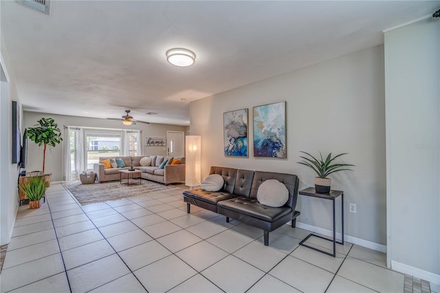 living room with light tile patterned floors and ceiling fan