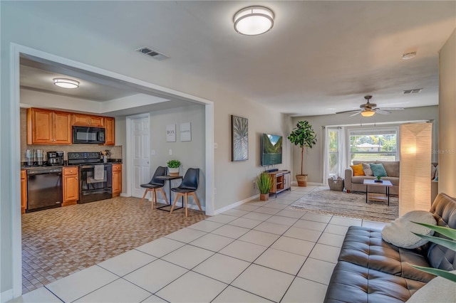 living room with light tile patterned flooring and ceiling fan