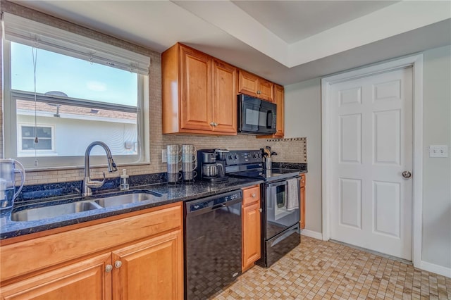 kitchen with sink, decorative backsplash, black appliances, and dark stone counters