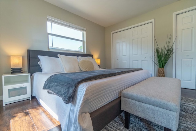 bedroom with dark wood-type flooring