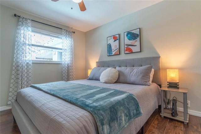 bedroom featuring dark hardwood / wood-style floors and ceiling fan