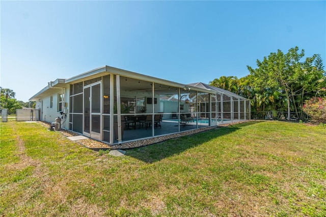 back of house with a patio and a yard