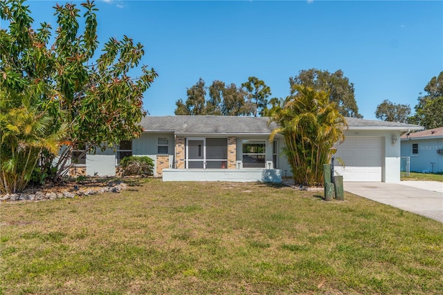 ranch-style house featuring a garage and a front lawn