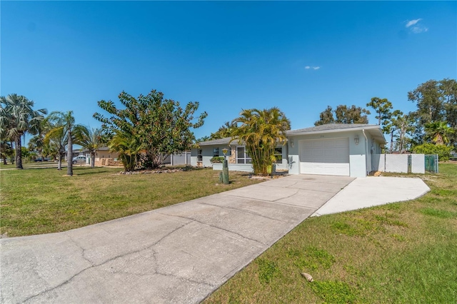 ranch-style house with a garage and a front lawn