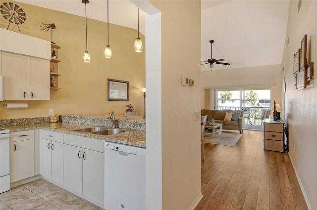 kitchen featuring pendant lighting, sink, white cabinetry, high vaulted ceiling, and white dishwasher