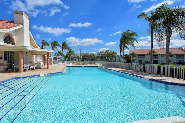 view of swimming pool featuring a patio area