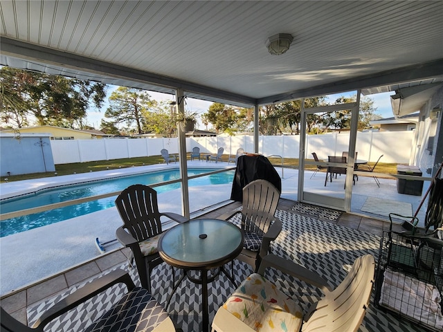 sunroom with a pool