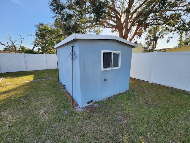 view of outdoor structure with a lawn