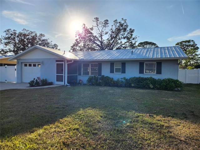 single story home with a garage and a front yard