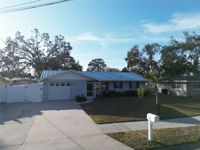 ranch-style house with a garage and a front yard