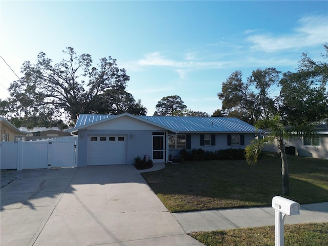 single story home with a garage and a front lawn