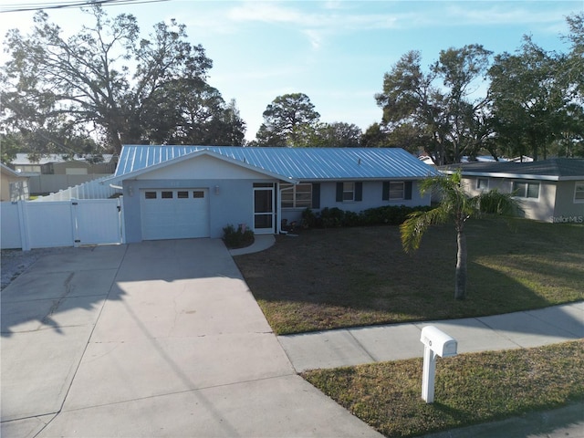 single story home with a garage and a front yard