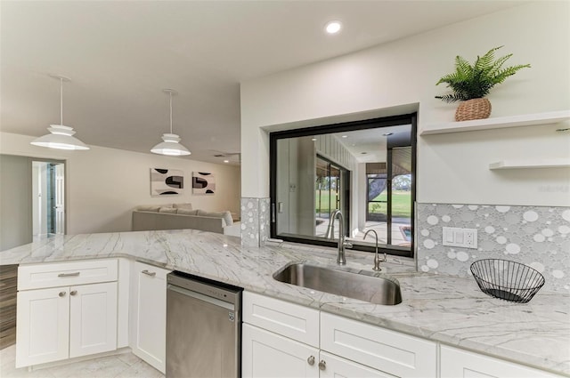 kitchen featuring sink, white cabinetry, hanging light fixtures, kitchen peninsula, and dishwasher