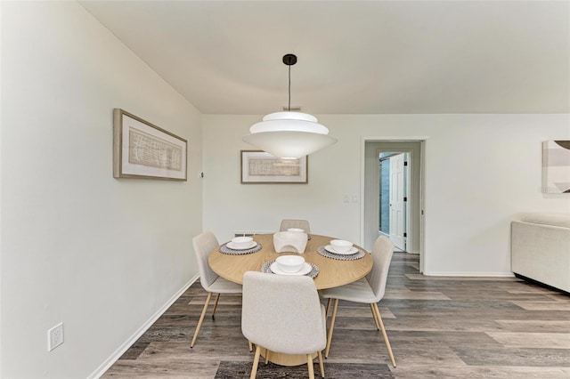 dining room with wood-type flooring