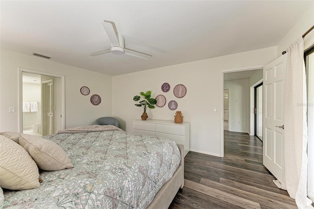 bedroom featuring ceiling fan, ensuite bathroom, and dark hardwood / wood-style floors