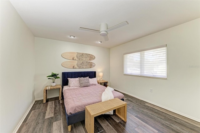 bedroom with dark hardwood / wood-style flooring and ceiling fan