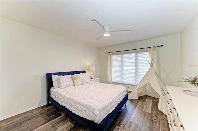 bedroom featuring ceiling fan and dark hardwood / wood-style floors