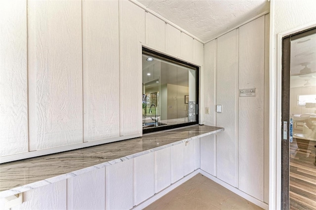 bathroom with sink and a textured ceiling