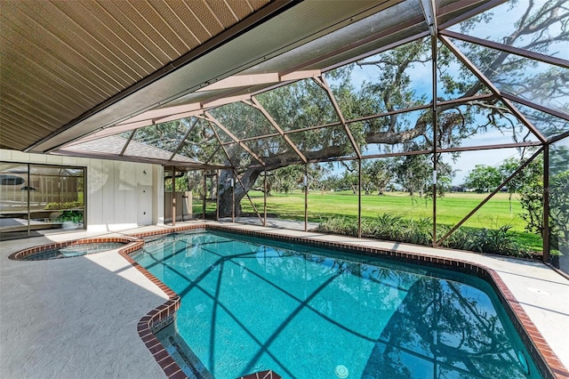 view of swimming pool featuring an in ground hot tub, a patio, and glass enclosure