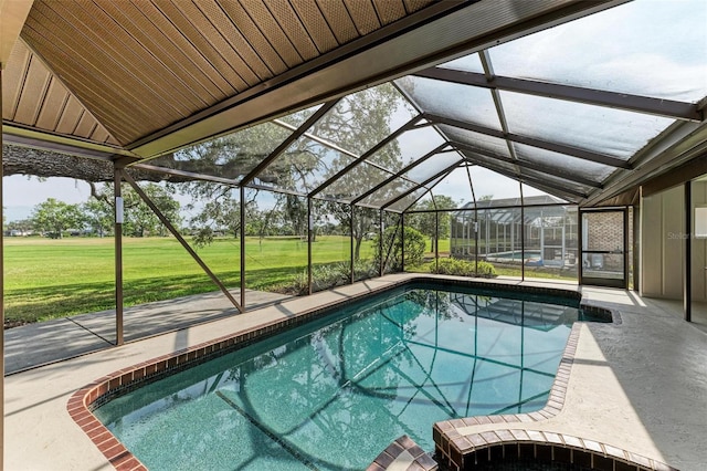 view of pool with a yard, a lanai, and a patio area